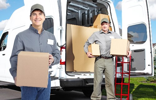 Well-organized long-term storage unit with labeled boxes and furniture