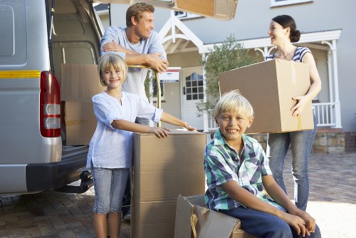 Professional movers handling furniture in a Croftonpark apartment